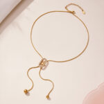 Round bead tassel stainless steel full zirconium Japanese character pull-out collarbone chain plated with 18k gold, fashionable and simple jewelry - Image 2