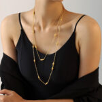 The golden double-layer beaded sweater chain exudes a grand, high-end and light luxury feel. It is a long titanium-steel layered necklace that is a bestseller for autumn and winter - Image 2