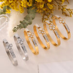 French-style cold and elegant jewelry, heart-shaped spliced design, inlaid zircon and white shell, with a sense of design, titanium steel bracelet